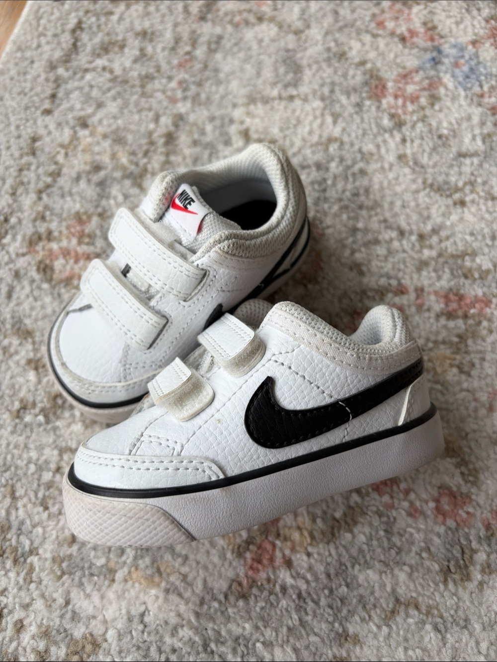 Nike size 4 baby/toddler White Sneakers with Black Swoosh Velcro Straps
